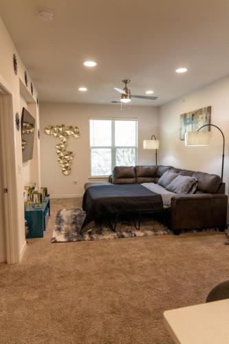 a living room with a bed and a couch at Home Away from Home in Charlotte