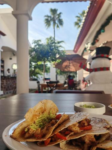 a plate of food on a table with a sandwich at Hotel Muñoz de Luna in Huajuapan de León