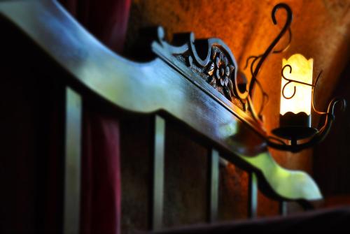 a wooden bench with a light on it at S.Nikolis' Historic Boutique Hotel in Rhodes Town