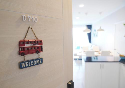 a door with a sign that says welcome at My Resort Hua Hin - by Great Days in Hua Hin