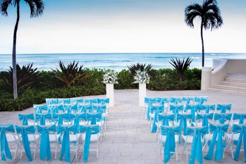a set up for a wedding at the beach at Moana Surfrider, A Westin Resort & Spa, Waikiki Beach in Honolulu