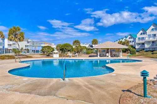 a swimming pool with a gazebo and some houses at Plantation West #1348 in Gulf Shores