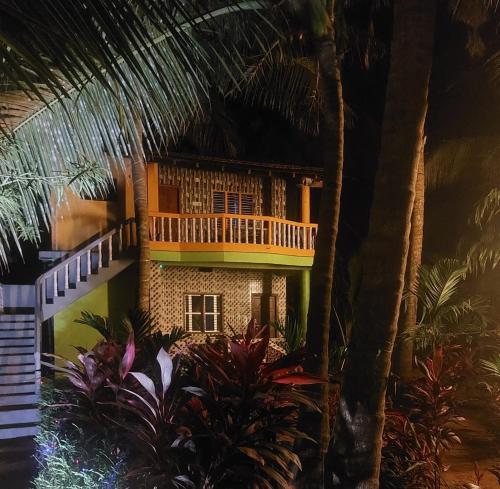 a model of a house with trees and plants at Areca Nest in Gokarna