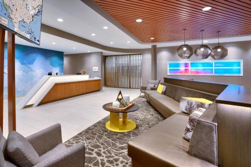 a lobby of a hotel with a couch and a table at Springhill Suites by Marriott Colorado Springs North/Air Force Academy in Colorado Springs