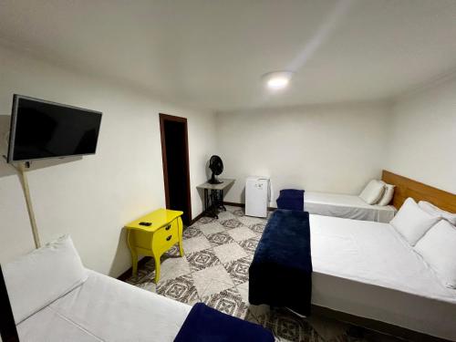Ένα ή περισσότερα κρεβάτια σε δωμάτιο στο Hotel Buriti da Serra