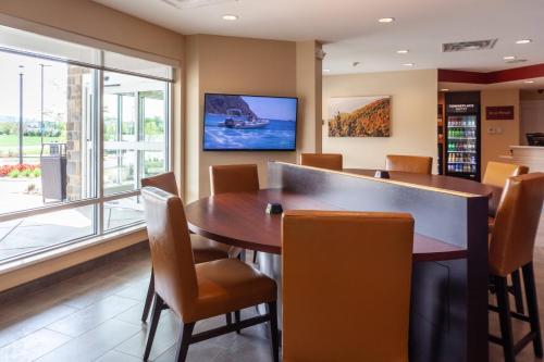 a dining room with a table and chairs at TownePlace Suites by Marriott Front Royal in Front Royal