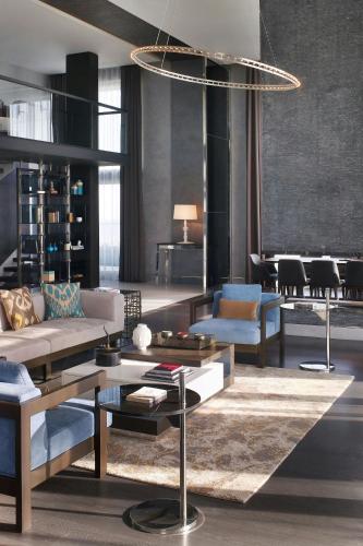 a living room with a couch and a table at Le Meridien Istanbul Etiler in Istanbul