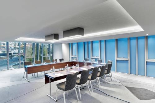 a conference room with a long table and chairs at Le Meridien Istanbul Etiler in Istanbul