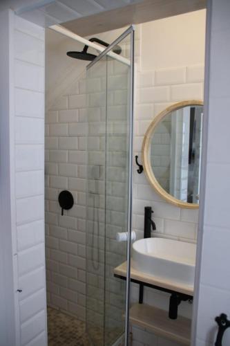 a bathroom with a sink and a mirror at Cozy Lounge - Visit Langebaan in Langebaan