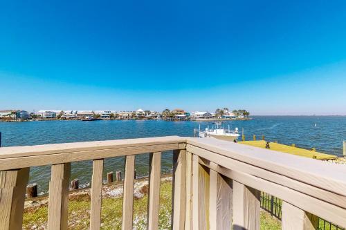 a view of the water from a balcony of a dock at Bay Dream Believer in Dauphin Island