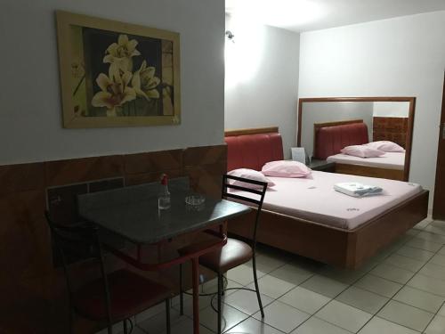 Postel nebo postele na pokoji v ubytování Onix Motel