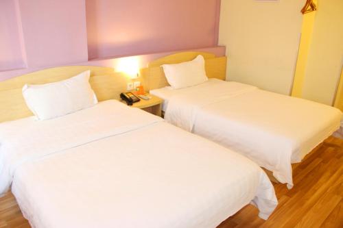 Letto o letti in una camera di 7Days Inn Zhujiang Road Subway station