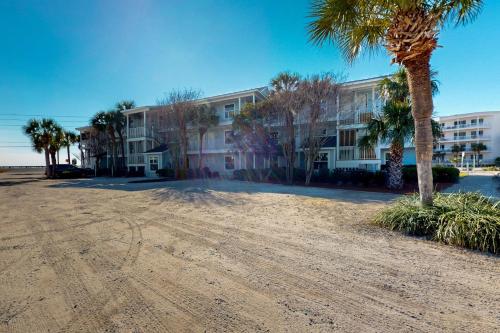 an empty parking lot in front of a building at Summerspell 103 in Destin