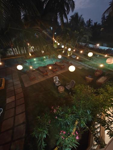 an overhead view of a patio at night with lights at SOLS Backyard in Arambol