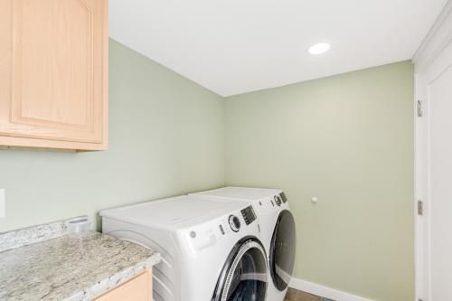 a laundry room with a washer and dryer at Oceanside Skies - Main House in Oceanside