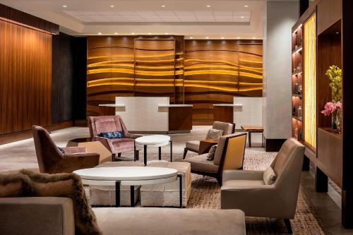 a lobby with couches and chairs and a table at The Westin Pittsburgh in Pittsburgh