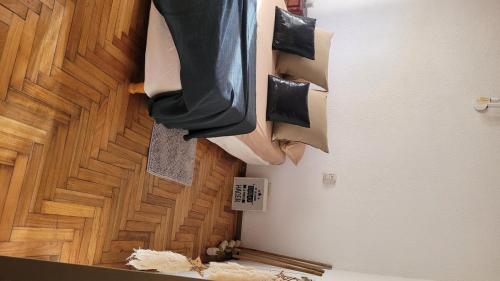 a room with a wooden floor with clothes hanging on the wall at casa quinta Ohana in Manuel Alberti