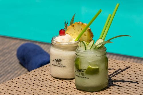 two mason jars filled with food on a table at Protea Hotel by Marriott Cape Town Durbanville in Bellville