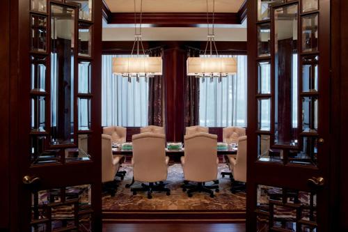 a dining room with a table and chairs at The Ritz-Carlton Atlanta in Atlanta