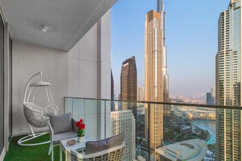 a balcony with a view of a city at Luxury 4-Bed Escape in Downtown Dubai That Sleeps 9 in Dubai