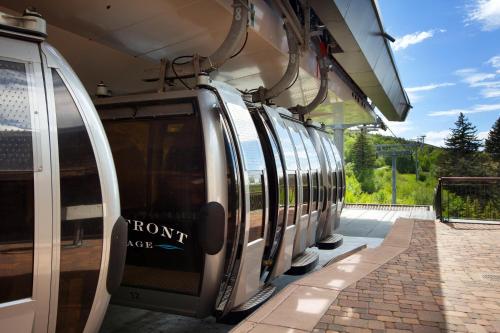a train stopped at a train station with its doors open at The Westin Riverfront Mountain Villas, Beaver Creek Mountain in Avon