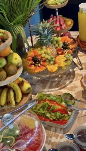 a table with many different types of fruits and vegetables at Bleu de Toi Boutique Hotel in Grand Baie
