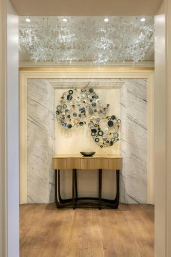 a table in a room with a painting on the wall at The Ritz-Carlton, Istanbul at the Bosphorus in Istanbul