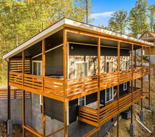 a house is being constructed with wood at Luxury Modern Gatlinburg Cabin Hot Tub and Sauna in Gatlinburg