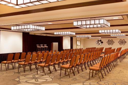 a row of chairs in a room with a screen at Sheraton Palo Alto Hotel in Palo Alto