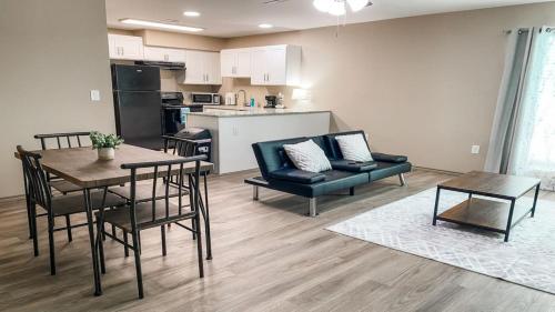 a living room with a table and chairs and a kitchen at Charming 1BR Getaway - Private, Pet Friendly, TV in Texas City