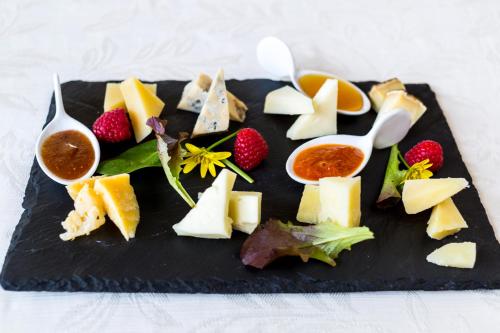 a plate of food with cheese and fruit on it at Tenuta Del Gallo in Amelia