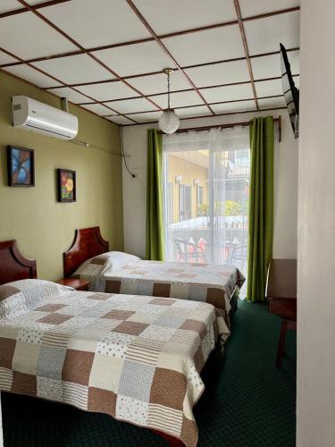 Postel nebo postele na pokoji v ubytování Hotel Malinche