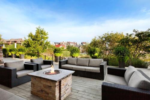 a patio with couches and a fire pit at The Westin Trillium House, Blue Mountain in Blue Mountains