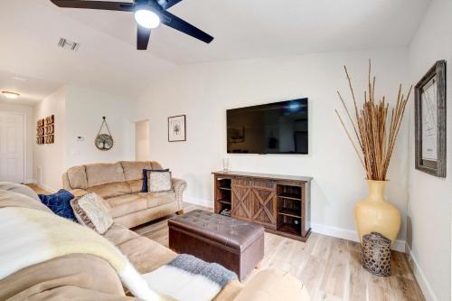 a living room with a couch and a fireplace at Golf and Pool Access Pet-Friendly Sebring Home! in Sebring