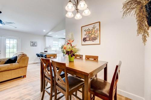 a dining room and living room with a table and chairs at Golf and Pool Access Pet-Friendly Sebring Home! in Sebring