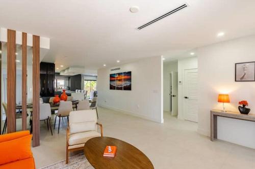 a living room with a table and a dining room at Miami Oasis by Brickell and Beaches in Miami