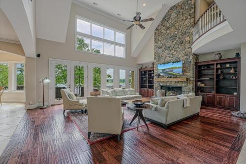 a large living room with a large stone fireplace at Dream Lake Castle in Mineral