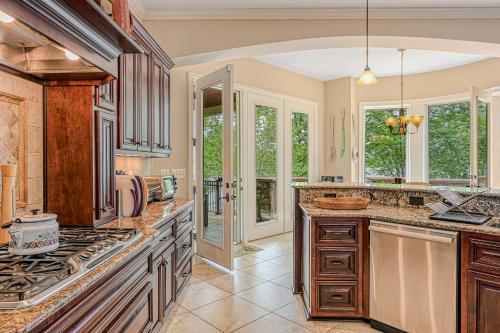 a kitchen with wooden cabinets and a stove top oven at Dream Lake Castle in Mineral