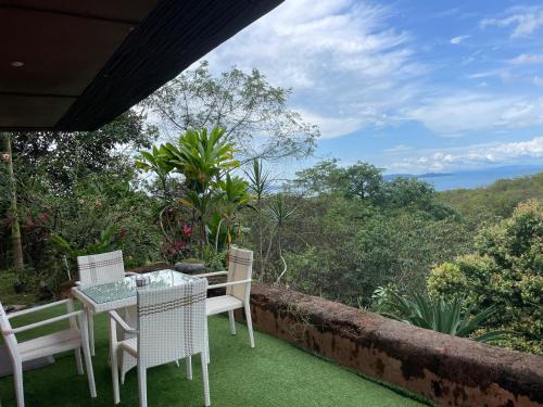 a table and chairs on the balcony of a house at Torio sea view in Torio