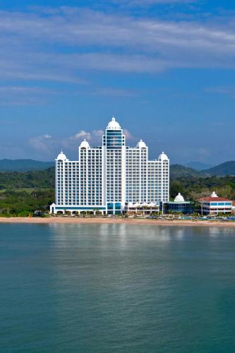 a large white building on the shore of the water at The Westin Playa Bonita Panama in Playa Bonita Village