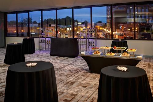 a room with a table with food on it at Marriott East Lansing at University Place in Lansing