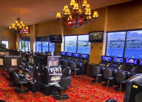 a room filled with lots of slot machines at The Edgewater Hotel and Casino in Laughlin