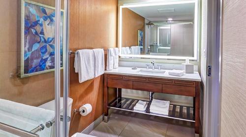 a bathroom with a sink and a mirror at Mystic Lake Casino Hotel in Prior Lake