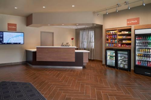 a store lobby with a counter and a refrigerator at TownePlace Suites by Marriott Windsor in Windsor
