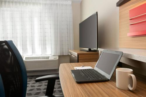 a laptop computer sitting on a desk in an office at TownePlace Suites Cedar Rapids Marion in Cedar Rapids