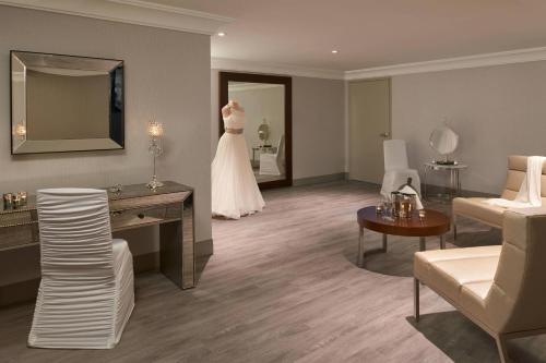 a dress is hanging in a living room at TownePlace Suites by Marriott Oshawa in Oshawa