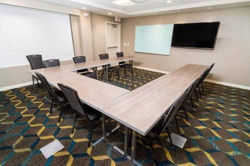 a conference room with a long table and chairs at Residence Inn by Marriott Rocklin Roseville in Roseville