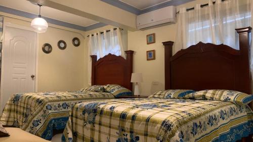a bedroom with two beds in a room at Apartment in San Pedro de Macoris. in San Pedro de Macorís