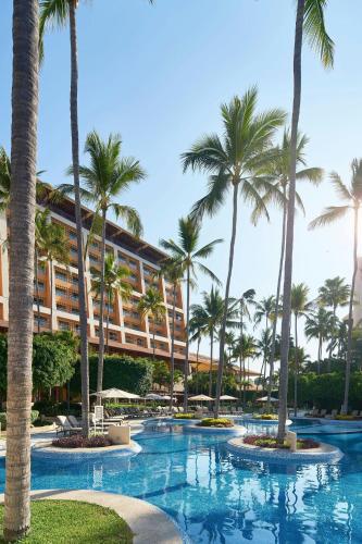 a resort with palm trees and a swimming pool at The Westin Resort & Spa, Puerto Vallarta in Puerto Vallarta