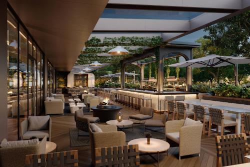 a rendering of a restaurant with tables and chairs at The Ritz-Carlton, Toronto in Toronto